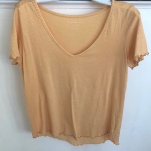 Yellow American eagle top with lettuce  lining